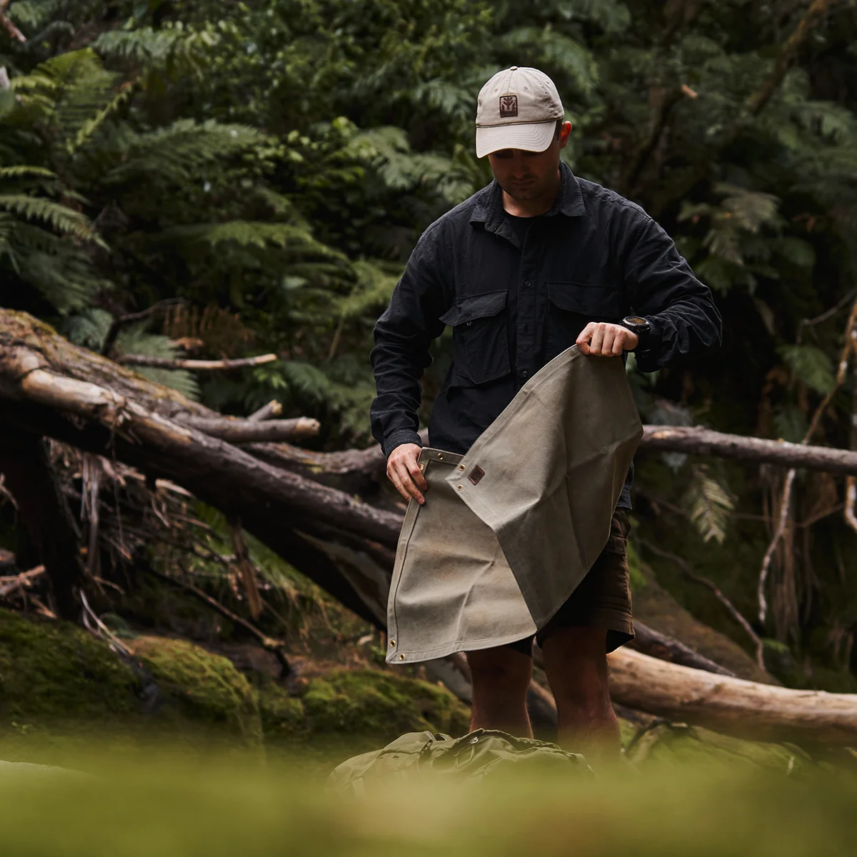 Waxed canvas ground mat in forest