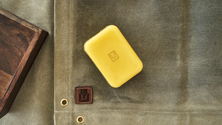 A block of beeswax sitting on a canvas sheet ready to be utilised for waterproofing